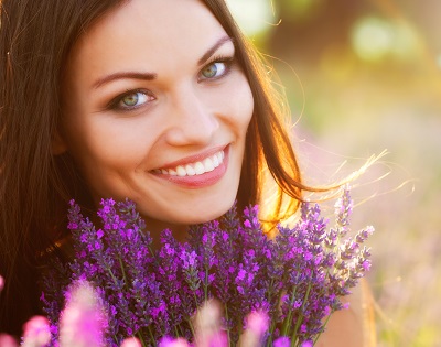 smiling woman with perfect smile on lavender field