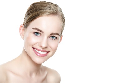 beautiful young blonde smiling woman with perfect white teeth in white background