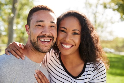 couple smiling in the park